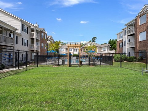 Leash-free dog park with black fencing at Chace Lake Villas apartments in Birmingham, AL